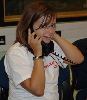 Anne Marie Evans fielding calls to the studio.
