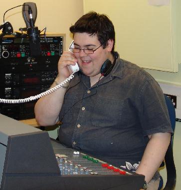 Jamie Hughes testing out the phone-in system in the studio.
